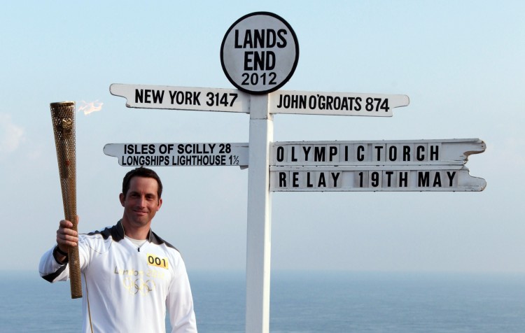 Olympic gold medal sailor Ben Ainslie is the first London 2012 torchbearer. He sets off from the famous Land's End sign post. (Matt Cardy/Stringer/Getty Images Sport) Olympic gold medal sailor Ben Ainslie is the first London 2012 torchbearer. He sets off from the famous Land's End sign post. (Matt Cardy/Stringer/Getty Images Sport)