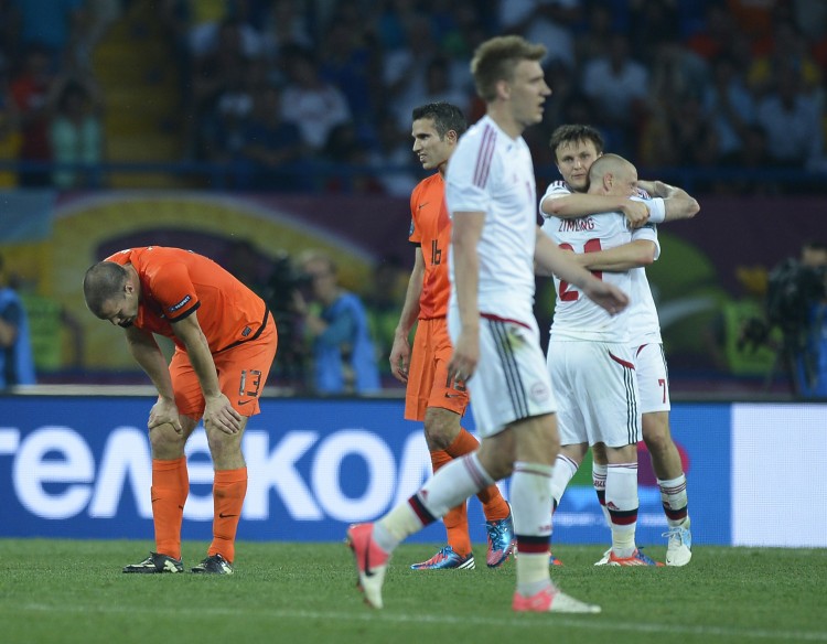 Denmark players celebrate after winning Denmark players celebrate Euro 2012's first major upset after beating Netherlands on Saturday in Ukraine. (Filippo Monteforte/AFP/GettyImages)