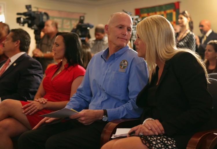 Florida Gov. Rick Scott speaks with Attorney General Pam Bondi during a bill signing ceremony Florida Gov. Rick Scott speaks with Attorney General Pam Bondi during a bill signing ceremony