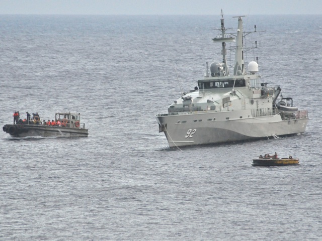 146655193 A Royal Australian Navy Ship takes part in a rescue effort
