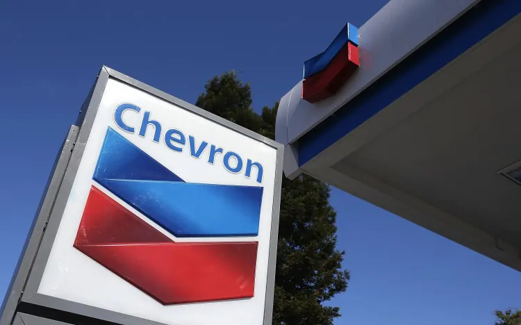 A sign is posted at a Chevron gas station in San Rafael, California, in a file photo. (Justin Sullivan/Getty Images)