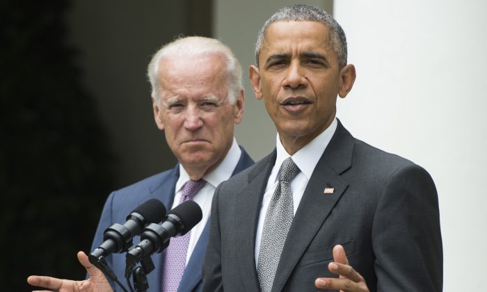 President Barack Obama speaks alongside Vice President Joe Biden about the Supreme Court's ruling to uphold the subsidies that comprise the Affordable Care Act, known as Obamacare, in the White House on June 25, 2015. (Saul Loeb/AFP/Getty Images)