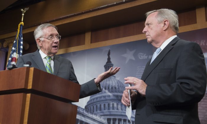 US Senator Dick Durbin, Democrat of Illinois and Senate Democratic Whip, speaks with Senate Democratic Leader Harry Reid (L), following a failed cloture vote to end debate on the Iran nuclear deal and block a final vote on the disapproval of the deal, in the US Senate at the US Capitol in Washington, DC, September 10, 2015. (Saul Loeb/AFP/Getty Images)