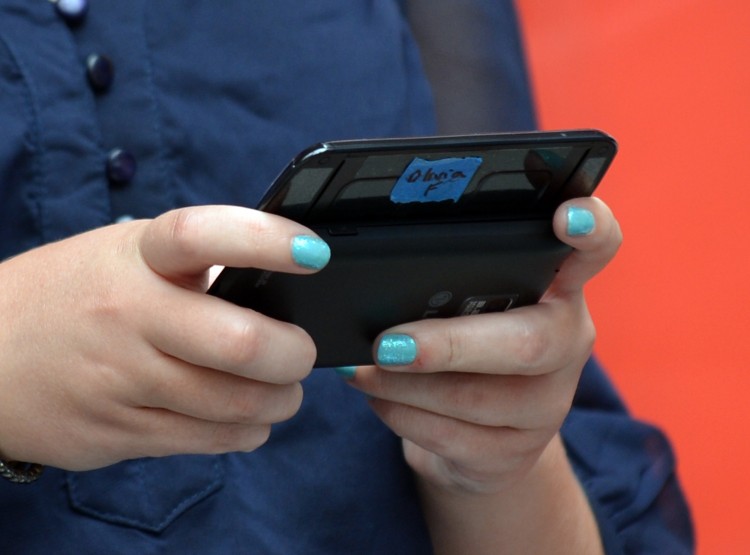 A contestant is seen here texting in an early round during the 6th Annual LG US National Texting Championship August 8, 2012 in New York's Times Square A contestant is seen here texting in an early round during the 6th Annual LG US National Texting Championship August 8, 2012 in New York's Times Square