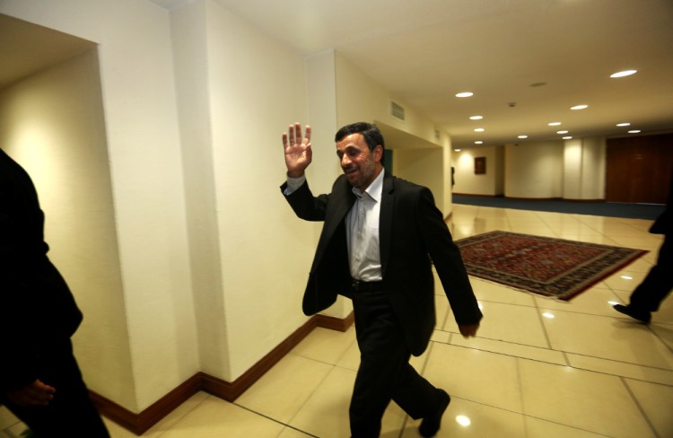 151026967 Iranian President Mahmoud Ahmadinejad waves as he walks into a room for his meetings on the sidelines of the Non-Aligned Movement (NAM) summit in Tehran on August 31, 2012. UN chief Ban Ki-moon has called on Iran to free all its political prisoners, in a speech obtained by AFP and delivered in Tehran on the sidelines of a Non-Aligned Movement summit. (BEHROUZ MEHRI/AFP/GettyImages)