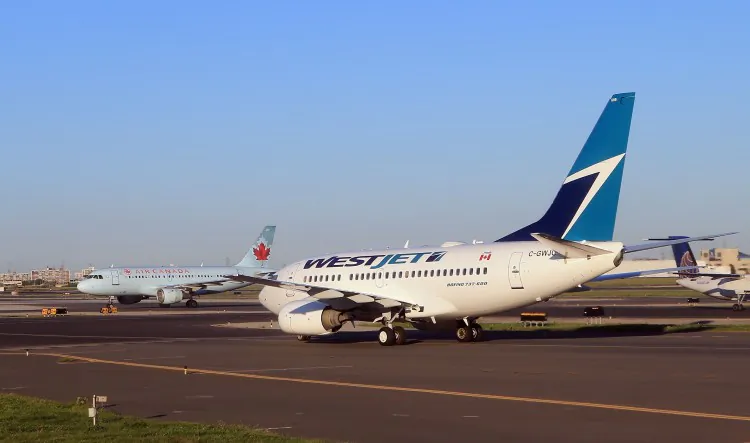 A WestJet flight and an Air Canada flight cross paths on a runway at the Lester B. Pearson airport in Toronto, in a file photo. (Bruce Bennett/Getty Images)