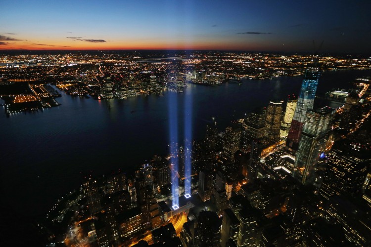 The 'Tribute in Light' shines as One World Trade Center (R) rises under construction on the eleventh anniversary of the terrorist attacks on lower Manhattan at the World Trade Center on September 11, 2012 in New York City. (Mario Tama/Getty Images)