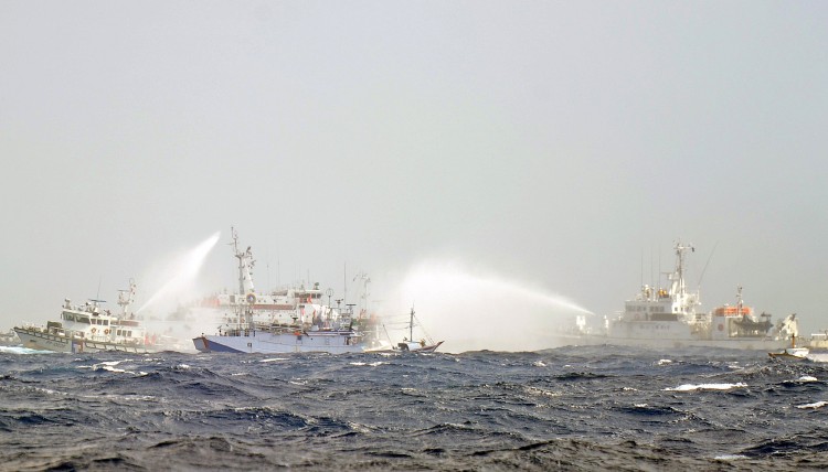 Japanese and Taiwan Coast Guard vessels use water cannon