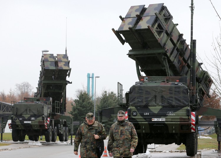 Soldiers of the Air Defence Missile Squadron 2 walk past Patriot missile launchers in the background in Bad Suelze, northern Germany  on Dec. 4, 2012. (Bernd Wustneck/AFP/Getty Images)