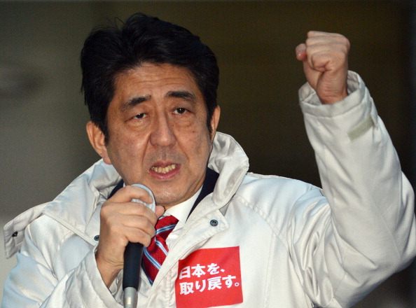 Japan's main opposition Liberal Democratic Party (LDP) leader Shinzo Abe waves gestures as he speaks in support of his party's candidate in Matsudo city on Saturday. (Yoshikazu Tsuno/AFP/Getty Images)