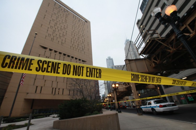 Crime scene tape surrounds the federal Metropolitan Correctional Center in the Loop after two convicted bank robbers escaped on Dec. 18, 2012 in Chicago, Illinois. (Scott Olson/Getty Images) 