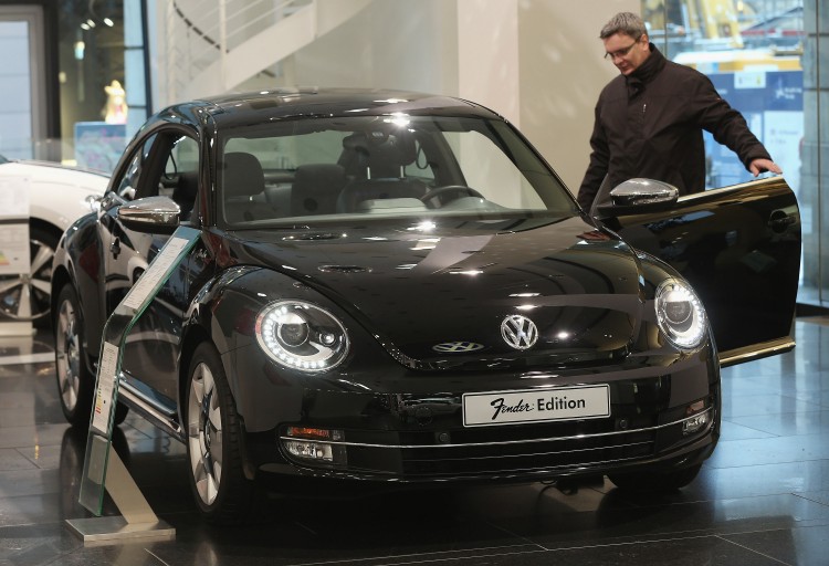 Volkswagen Group Delivers Over 9 Million Vehicles In 2012 A visitor looks at a VW Beetle Fender edition at a Volkswagen Group showroom on Jan. 14, 2013 in Berlin, Germany. The company announced record earnings Feb. 22 but provided a cautious outlook for 2013. (Sean Gallup/Getty Images)