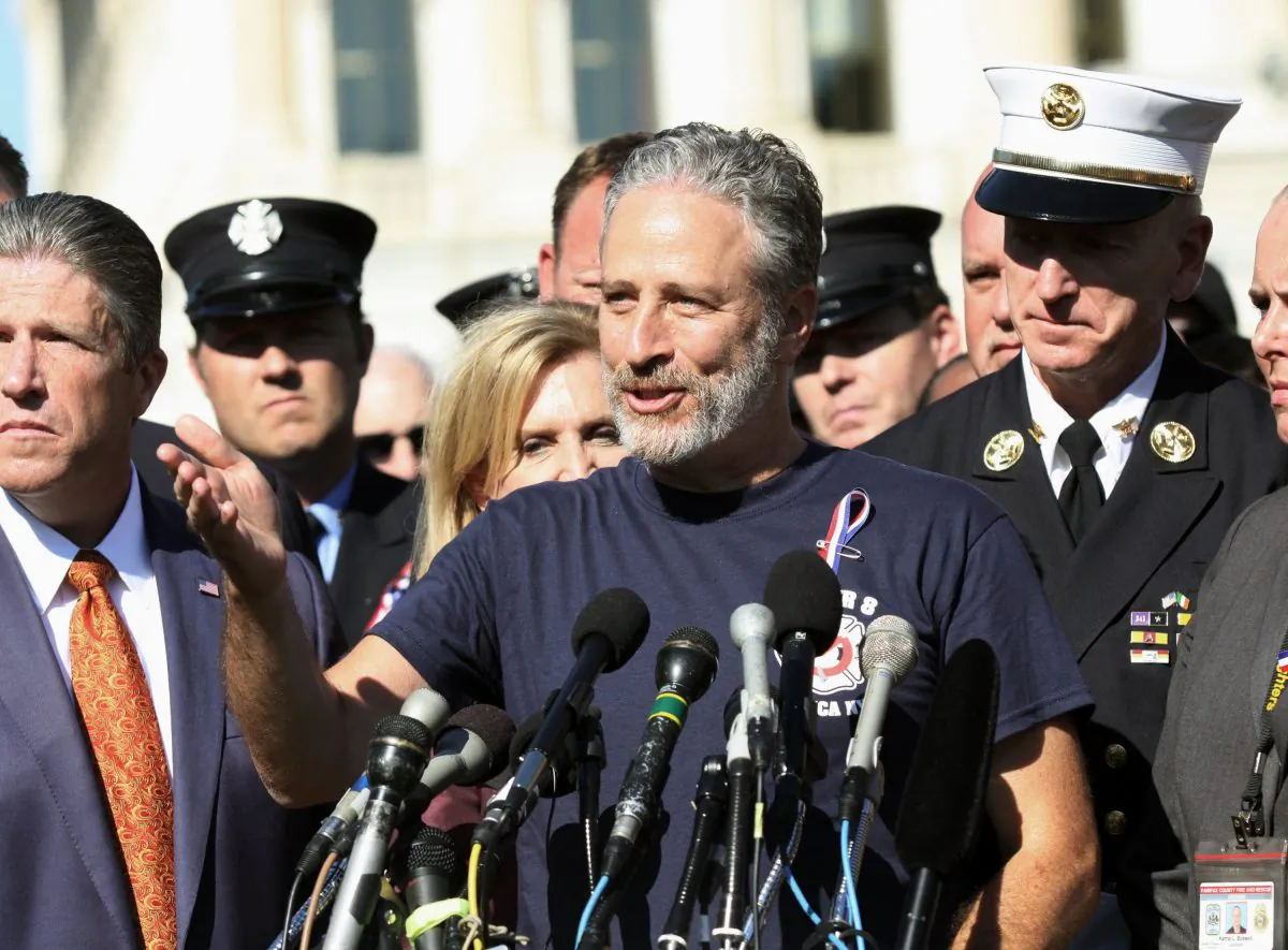 Comedian Jon Stewart stands with New York City first responders and speaks during a rally on Capitol Hill in Washington, Wednesday, September 16, 2015, calling for the extension of the the Zadroga Heath & Compensation Act that provides health care and compensation to 9/11 first responders and victims will come to an end if not renewed by Congress.  (AP Photo/Lauren Victoria Burke)