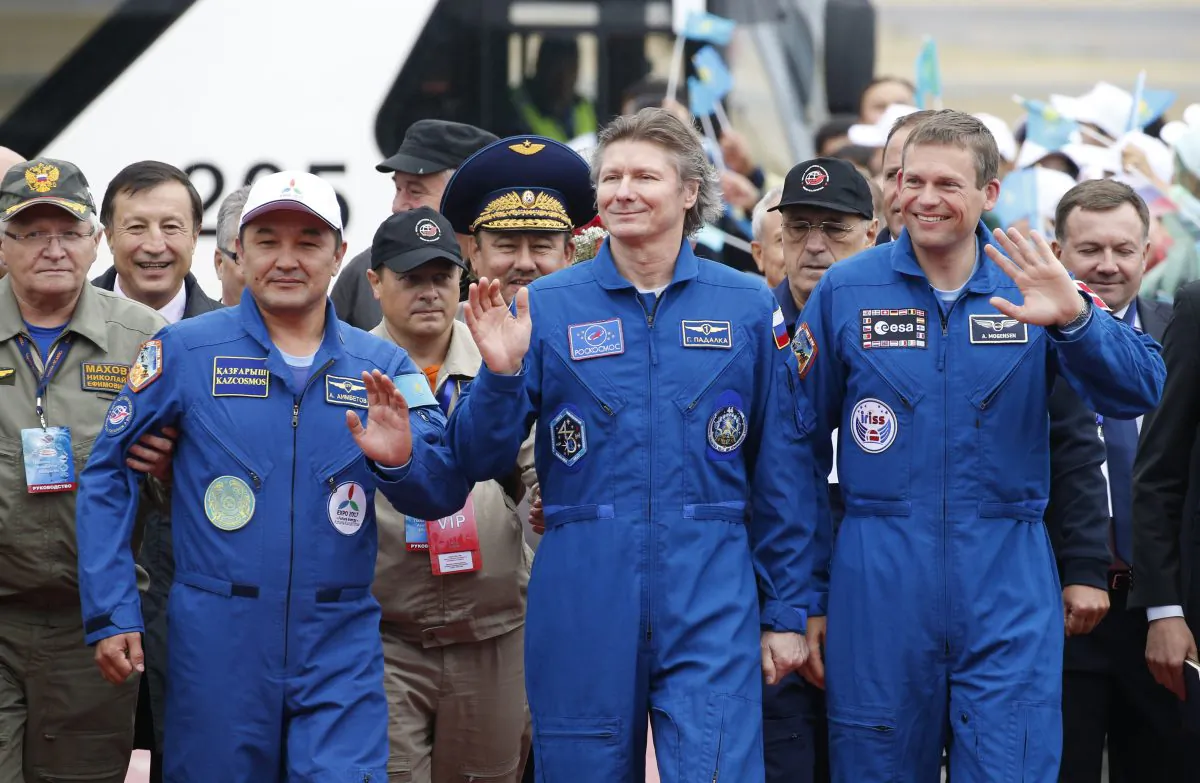 (L–R) Kazakhstan’s Aidyn Aimbetov, Russia's Gennady Padalka and Denmark's Andreas Mogensen at a welcoming ceremony in Kazakhstan's capital Astana on Sept. 12, 2015. Russian Soyuz TMA-16M capsule landed safely in Kazakhstan, bringing home a three-person crew from the International Space Station, including a record-breaking Russian cosmonaut. (Yuri Kochetkov/Pool Photo via AP)