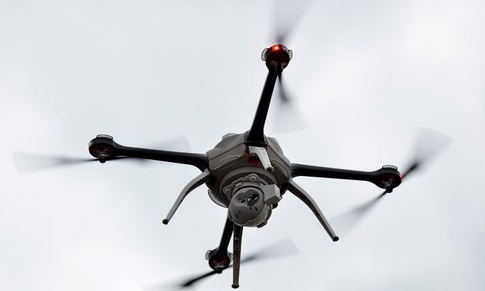 An unmanned surveillance drone flies at the Defence and Security Equipment International (DSEI) arms fair at the ExCeL centre in east London, on September 10, 2013. (BEN STANSALL/AFP/Getty Images)