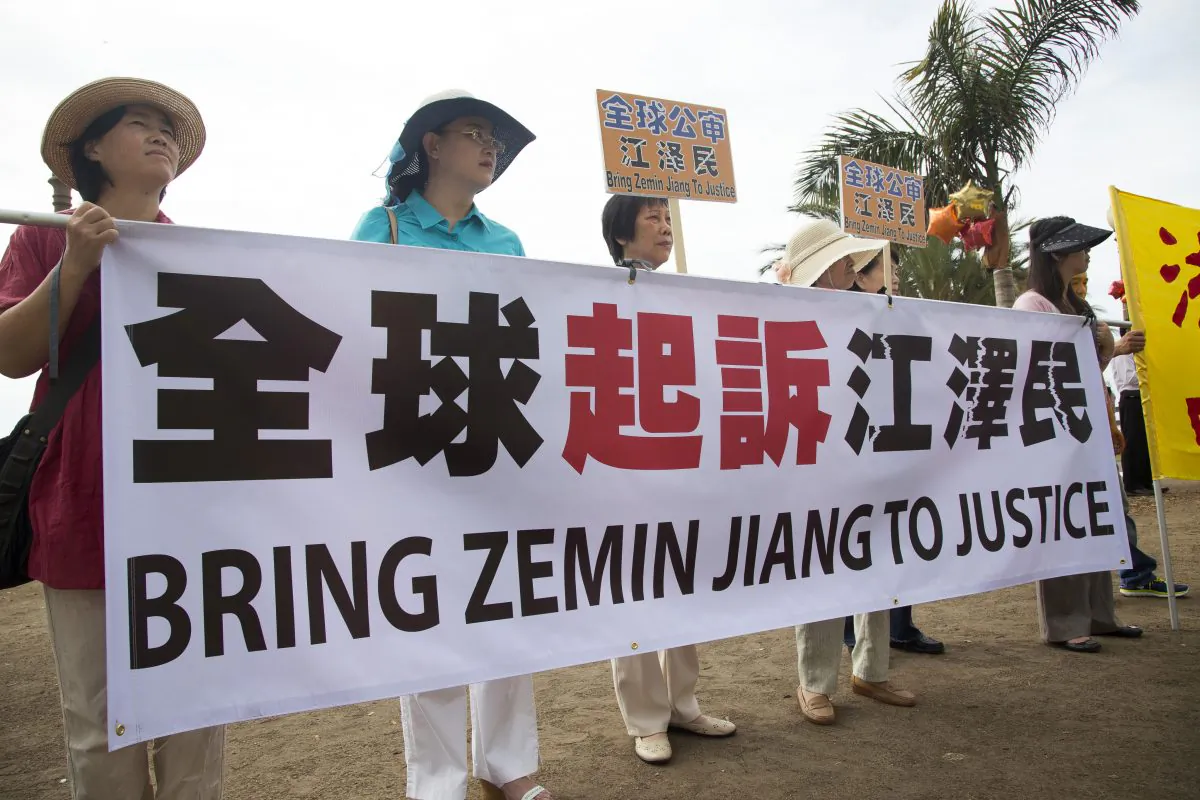Falun Gong practitioners and supporters hold a rally to support more than 170,000 lawsuits against former Chinese leader Jiang Zemin in Santa Monica, Calif. on Sept. 12. (Debra Cheng/Epoch Times)