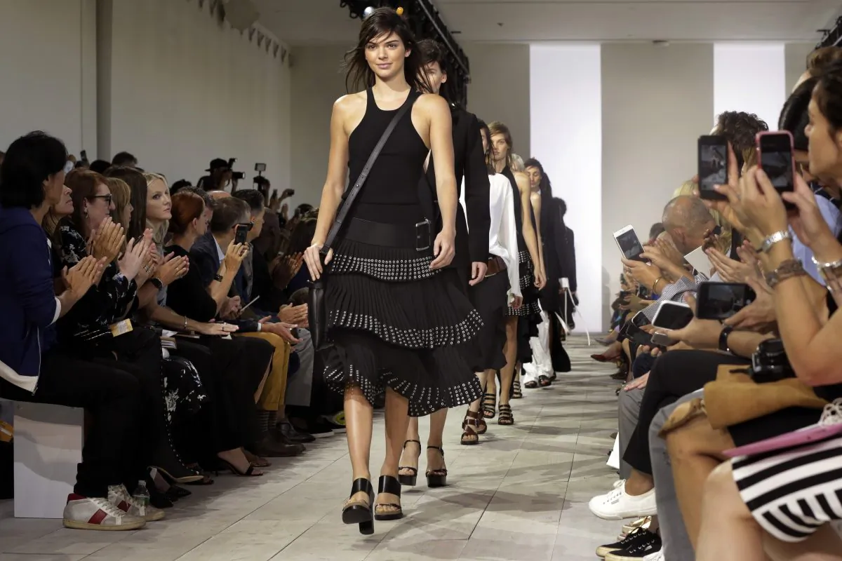 Kendall Jenner leads the finale of the Michael Kors Spring 2016 collection, during Fashion Week in New York, Wednesday, Sept. 16, 2015. (AP Photo/Richard Drew)