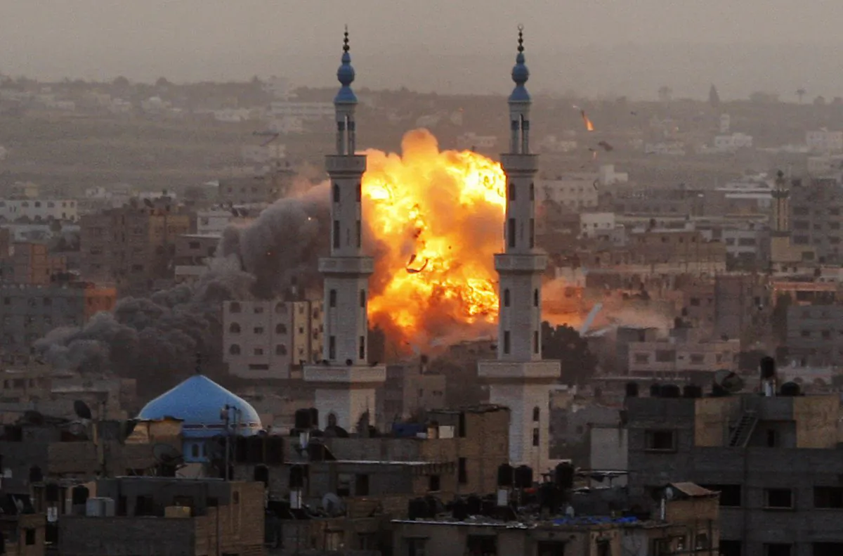Smoke rises during an explosion from an Israeli forces strike in Gaza City, Saturday, Nov. 17, 2012. Israel bombarded the Hamas-ruled Gaza Strip with nearly 200 airstrikes early Saturday, the military said, widening a blistering assault on Gaza rocket operations by militants to include the prime minister's headquarters, a police compound and a vast network of smuggling tunnels. (AP Photo/Hatem Moussa)