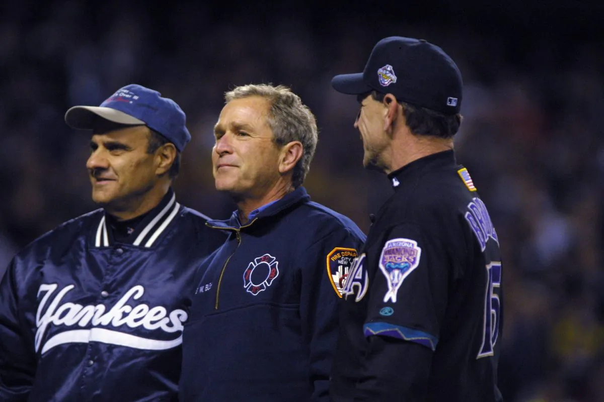 President George W. Bush talks with managers Joe Torre #6 of the New York Yankees and Bob Brenly #15 of the Arizona Diamondbacks before game 3 of the World Series at Yankee Stadium in New York, New York. Yankees win, 2-1 over the Diamondbacks. (Al Bello/ALLSPORT)