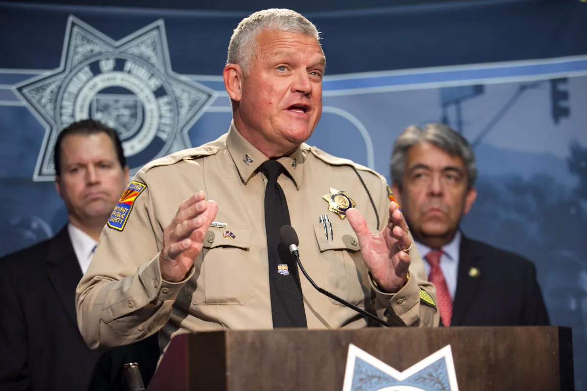 Colonel Frank Milstead, Director of the Department of Public Safety speaks during a press conference to announce the arrest of a suspect in the Phoenix freeway shootings, at DPS headquarters in Phoenix on Friday, Sept. 18, 2015. (David Wallace/The Arizona Republic via AP)