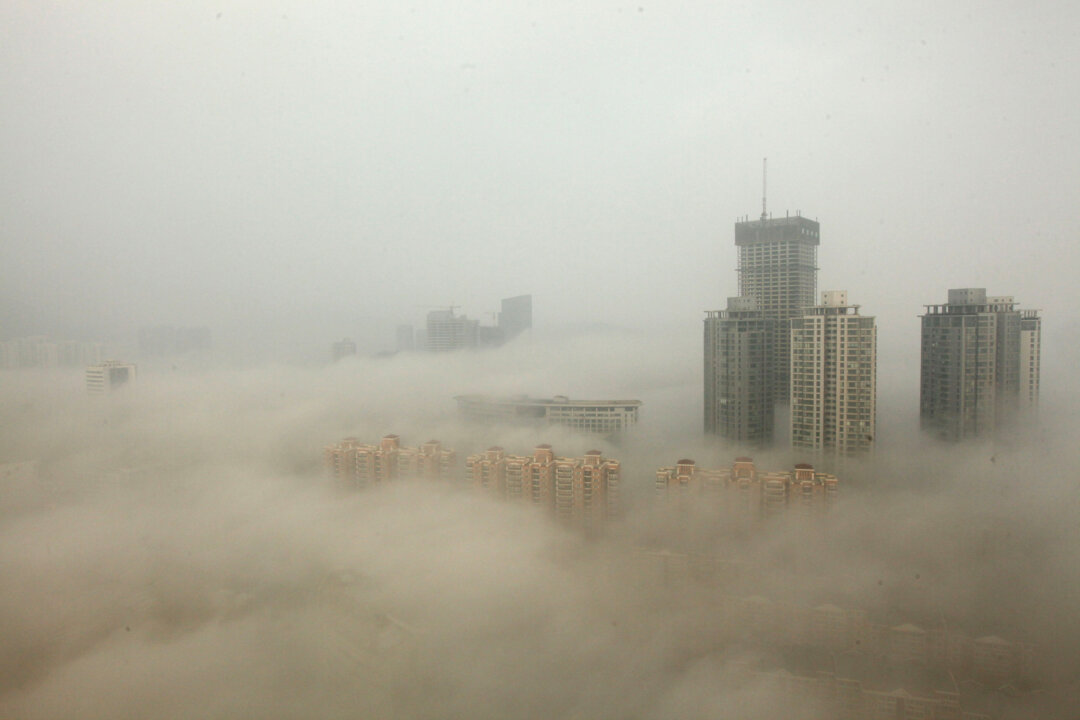 Buildings enshrouded in smog, mainly caused by air pollution, in Lianyungang, China, on Dec. 8, 2013. (ChinaFotoPress/Getty Images)