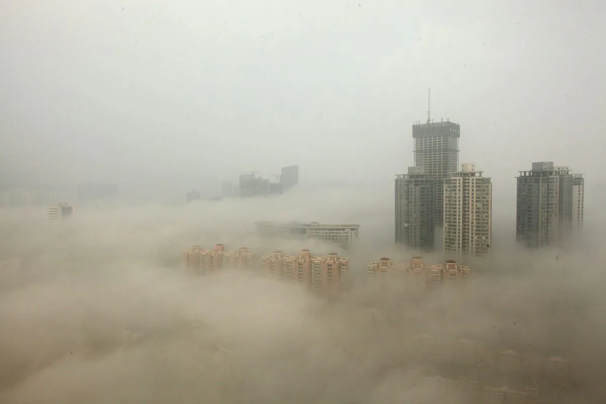 Buildings enshrouded in smog, mainly caused by air pollution, in Lianyungang, China, on Dec. 8, 2013. (ChinaFotoPress/Getty Images)