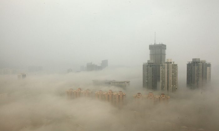 Buildings enshrouded in smog, mainly caused by air pollution, in Lianyungang, China, on Dec. 8, 2013. (ChinaFotoPress/Getty Images)
