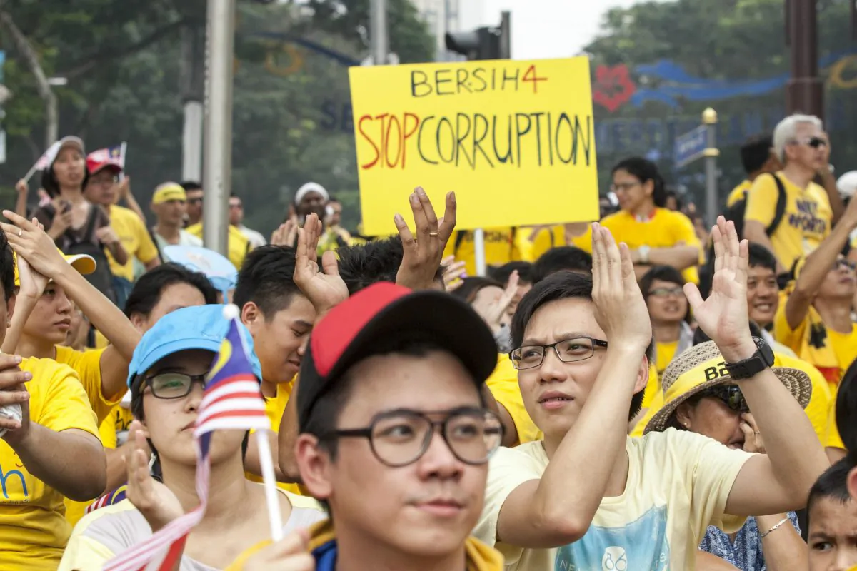 Protestors listen to speeches during the Bersih 4.0 rally in Kuala Lumpur, Malaysia, on Aug. 30, 2015. Prime Minister Najib Razak has become embroiled in a scandal involving state fund debts and allegations of deposits totaling 2.6 billion ringgit paid to his bank account. Razak has denied any wrongdoing. Thousands of people gathered to demand his resignation and a new general election. (Charles Pertwee/Getty Images)