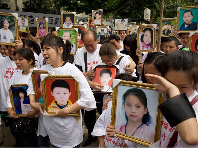 Parents of pupils killed when the Xinjian primary school collapsed in the May 12 earthquake cry as they hold portraits of their loved ones during a commemoration of Children's Day on the rubble-strewn school campus on June 1, 2008 in Dujiangyan, China. (Andrew Wong/Getty Images) Parents of pupils killed when the Xinjian primary school collapsed in the May 12 earthquake cry as they hold portraits of their loved ones during a commemoration of Children's Day on the rubble-strewn school campus on June 1, 2008 in Dujiangyan, China. (Andrew Wong/Getty Images)
