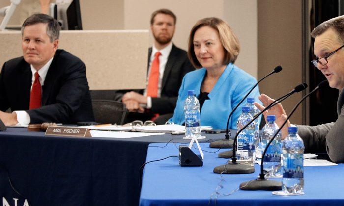 From left to right, U. S. Senators Steve Daines, Deb Fischer and Jon Tester appear at a hearing on pipeline safety in Billings, Mont., Friday, Sept. 18, 2015. The hearing at Montana State University, Billings came after a boom in U.S. energy production reversed years of declines in the number of pipeline mishaps. (Bob Zellar/The Billings Gazette via AP) MANDATORY CREDIT
