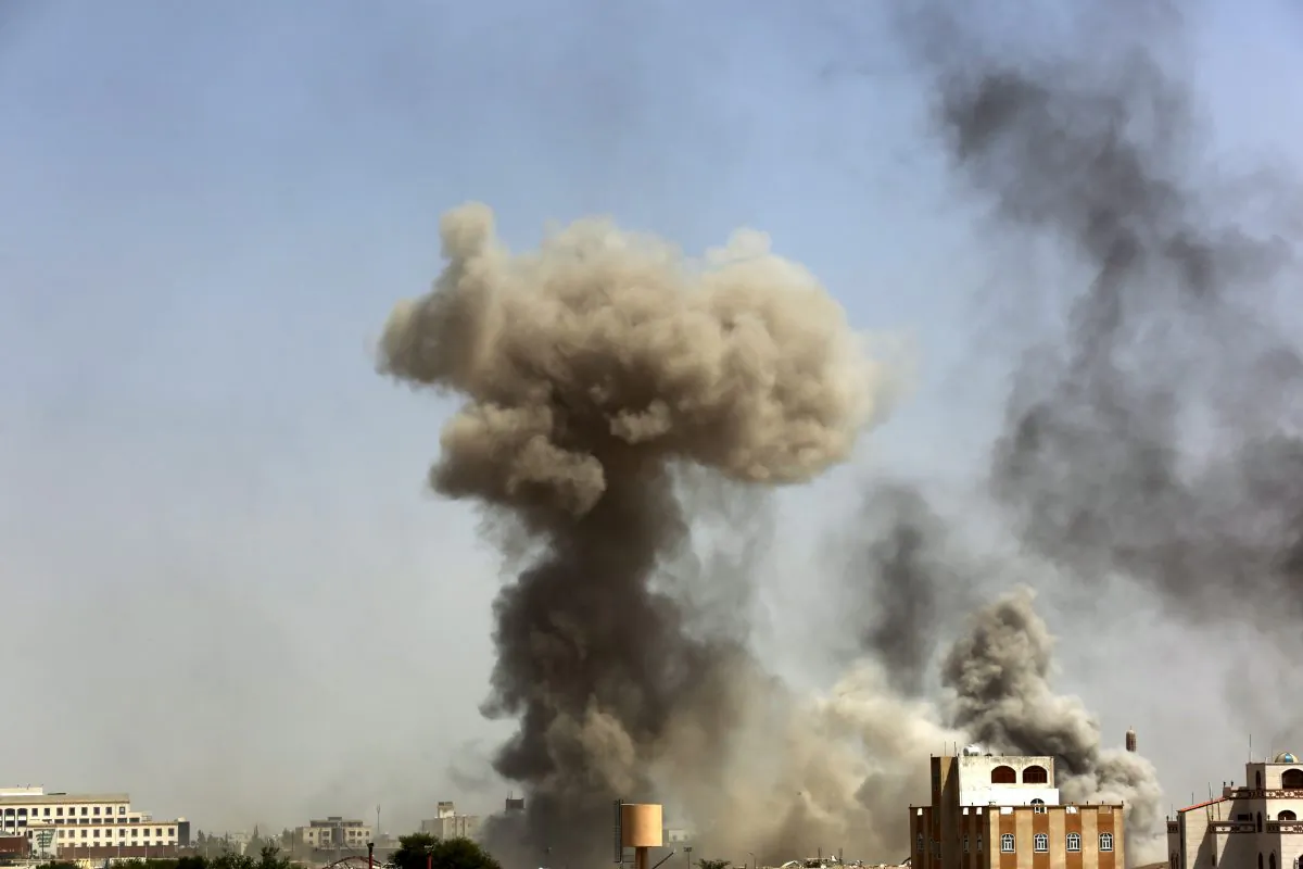 Smoke rises after a Saudi-led airstrike hits an army academy in Sanaa, Yemen, Sunday, Sept. 20, 2015. (AP Photo/Hani Mohammed)