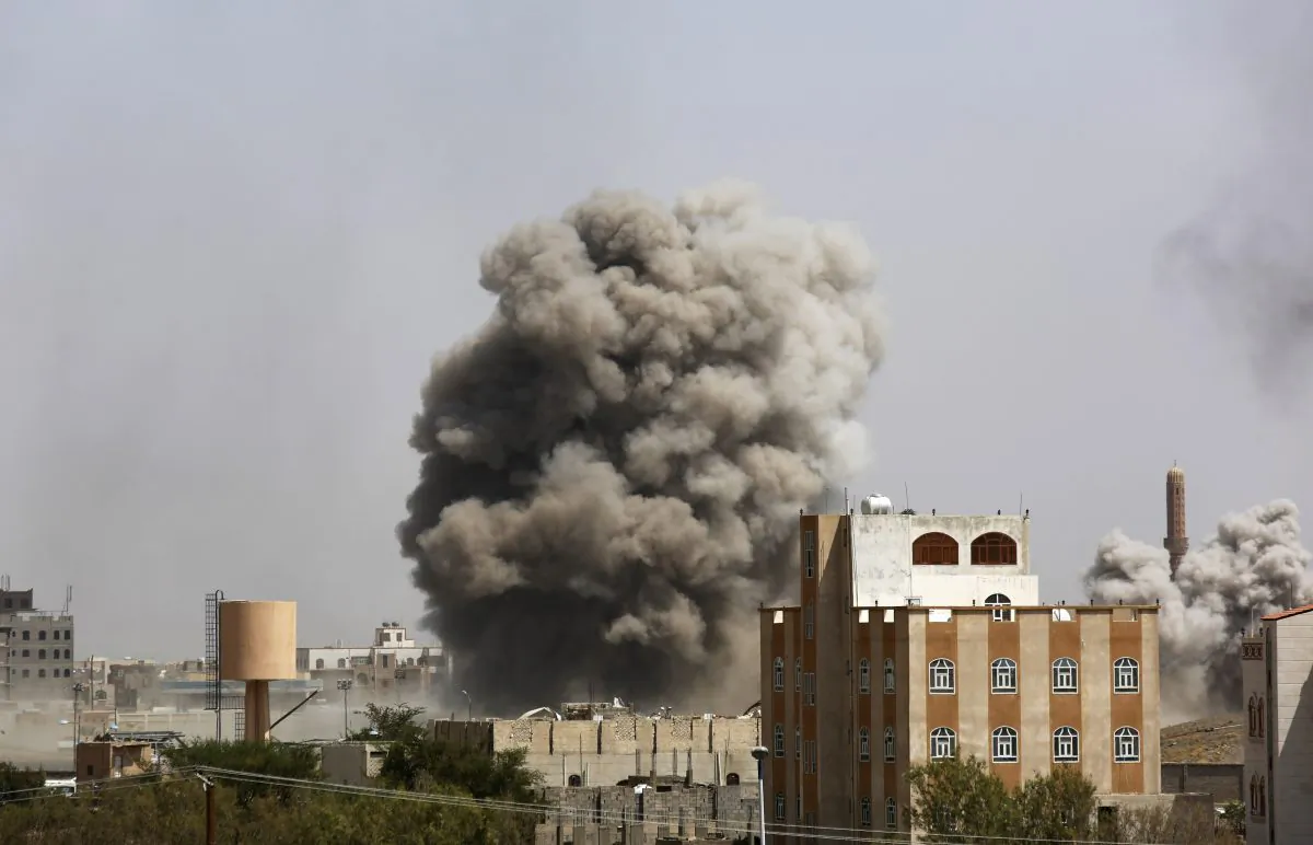 Smoke rises after a Saudi-led airstrike hits an army academy in Sanaa, Yemen, Sunday, Sept. 20, 2015. (AP Photo/Hani Mohammed)