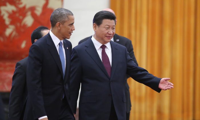 Chinese President Xi Jinping (R) and U.S. President Barack Obama (L) attend a welcoming ceremony inside the Great Hall of the People on November 12, 2014 in Beijing, China. (Feng Li/Getty Images) 