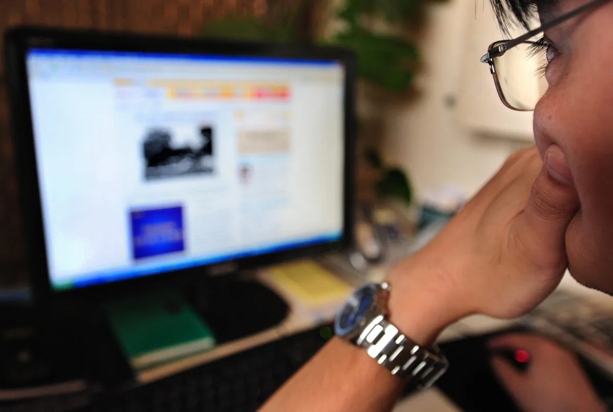 A man thinks while surfing the internet in Beijing on June 15, 2009. Whether China can develop the institutions to allow innovation will determine its economic future, says economist Ma Guangyuan. (Frederic J. Brown/AFP/Getty Images)