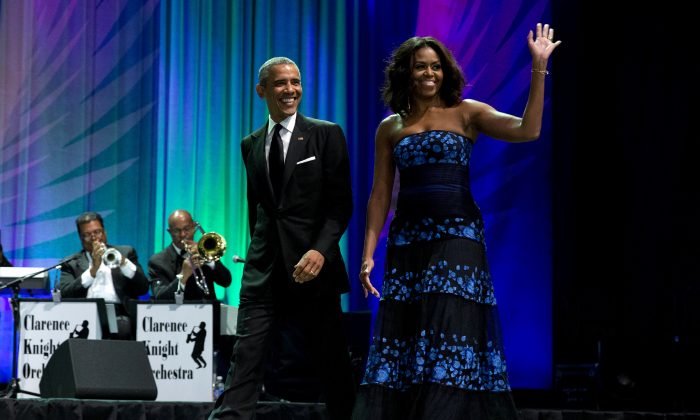 President Barack Obama and first lady Michelle Obama arrive at the Congressional Black Caucus Foundations 45th Annual Legislative Conference Phoenix Awards Dinner at the Walter E. Washington Convention Center in Washington, Saturday, Sept. 19, 2015, where the president spoke about the challenges facing black women, particularly in the areas of education, employment and criminal justice. (AP Photo/Carolyn Kaster)