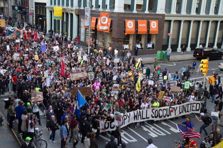 Occupy Wall Street protestors march down Broadway Thousands of Occupy Wall Street protesters march down Broadway toward Wall Street on Monday, forcing police to shut down all the side streets that intersect Broadway on May 1. (Benjamin Chasteen/The Epoch Times)