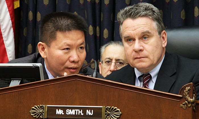 Pastor Bob Fu, founder and president of the ChinaAid Association, translates Chen Guangcheng speaking live via speakerphone for Rep. Chris Smith (R-N.J.), at the House Foreign Affairs subcommittee on Africa, Global Health, Global Human Rights and International Organization, on May 15, 2019. (Shar Adams/The Epoch Times)