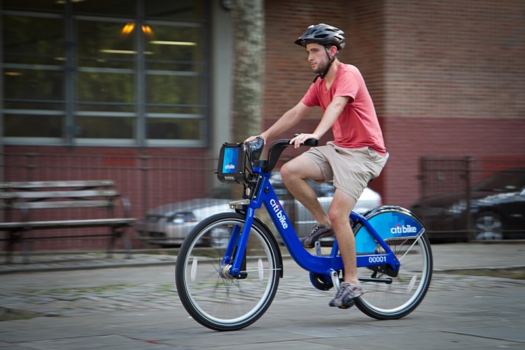  New Yorker Tim Haney tests out one of the bikes from Citi Bike at a recent demonstration of the system. The tentative rollout has been delayed to August. (Benjamin Chasteen/The Epoch Times)