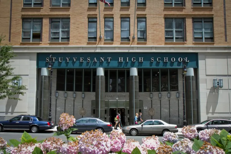Students walk past Stuyvesant High School in Manhattan, New York, in a file photo. (Benjamin Chasteen/The Epoch Times)