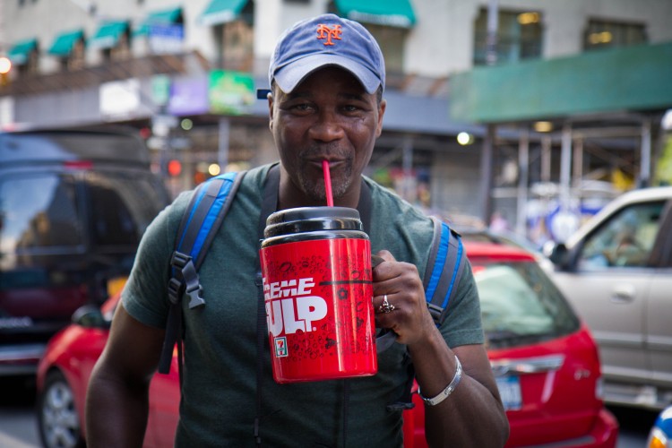 20120709_soda+Ban_Chasteen_IMG_9549 Eric Moor from Staten Island drinks an Extreme Gulp from 7-Eleven filled with Gatorade to protest Mayor Bloomberg's soda ban in Manhattan. (Benjamin Chasteen/The Epoch Times)