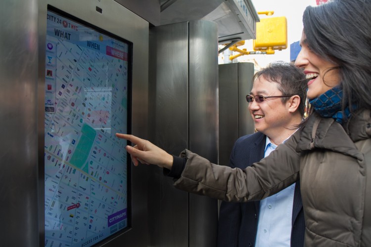 Jennifer Falk (R), Executive Director of the Union Square Partnership; and Y.K. Cho (L), B2B senior VP of LG Electronics, use the next generation public information system called City24/7 at a phone booth at Union Square in New York City on Nov. 20, 2012. (Benjamin Chasteen/The Epoch Times) Jennifer Falk (R), Executive Director of the Union Square Partnership; and Y.K. Cho (L), B2B senior VP of LG Electronics, use the next generation public information system called City24/7 at a phone booth at Union Square in New York City on Nov. 20, 2012. (Benjamin Chasteen/The Epoch Times)