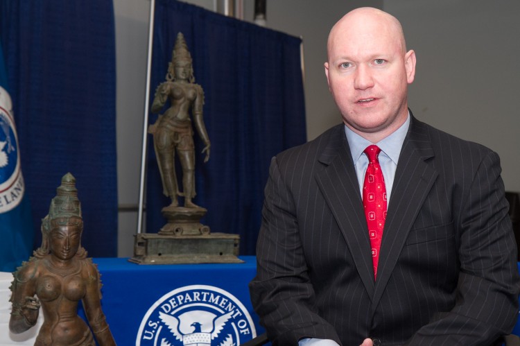  James T. Hayes Jr., special agent of Homeland Security Investigations, sits in front of looted Indian sculptures worth at least $5 million in New York City, Dec. 5, 2012. The sculptures were seized at Port Newark, N.J. (Benjamin Chasteen/The Epoch Times) 