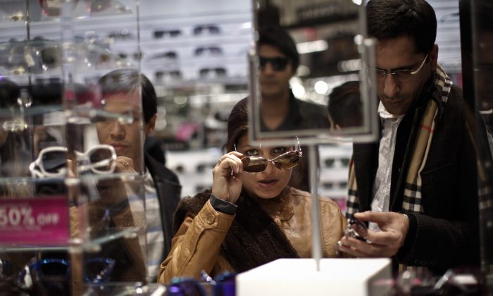 Customers shop for sun glasses at Macy's Herald Square after the store opened its doors at 8 pm Thanksgiving day in New York City, on Nov. 28, file photo. (Kena Betancur/Getty Images)