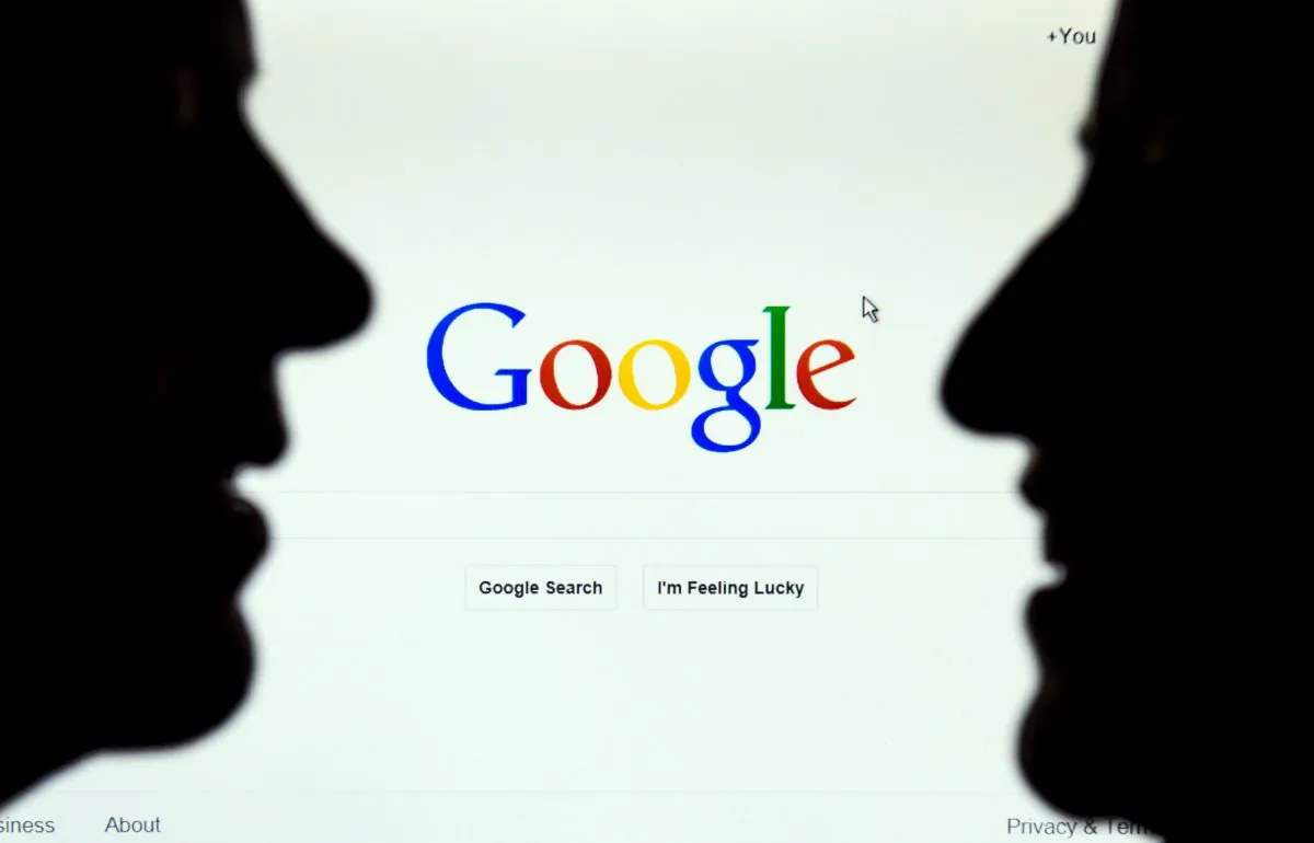 Two figues in front of the Google internet homepage, in a file picture from Lille, France. (PHILIPPE HUGUEN/AFP/Getty Images)