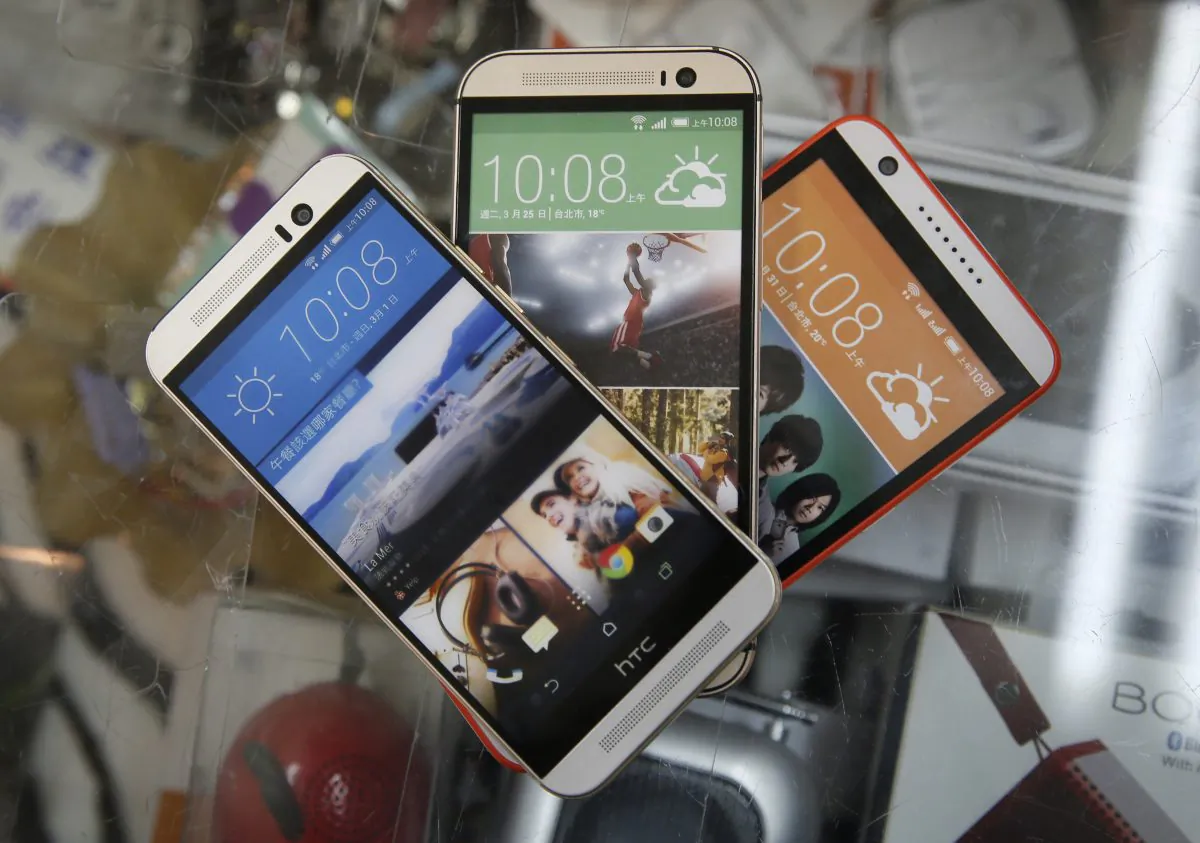 Used HTC smartphones on display in a phone shop in Taipei, Taiwan, on Sept. 21, 2015. (AP Photo/Wally Santana)