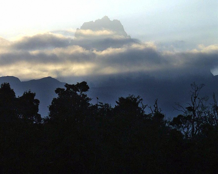 A cloud covers section of the Mount Kenya, 21 July 2003, in Naro Moru, Kenya. (Simon Maina/AFP/Getty Images)