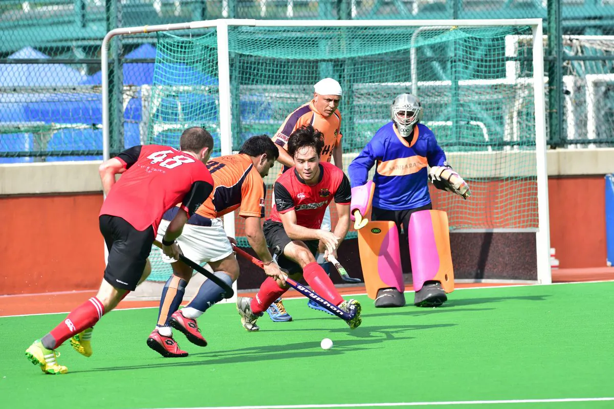 Valley-A on the attack against SSSC-A in their season opening Premier Division game at the HKFC ground on Sunday Sept 20, 2015. SSSC’s (No 31) Aminder Dhessi steals the ball from Valley’s James Page (48) and Max Parry, with goalie Gurdeep Singh and Satpal Singh watching progress. SSSC edged the evenly fought match 1-0. (Bill Cox/Epoch Times)