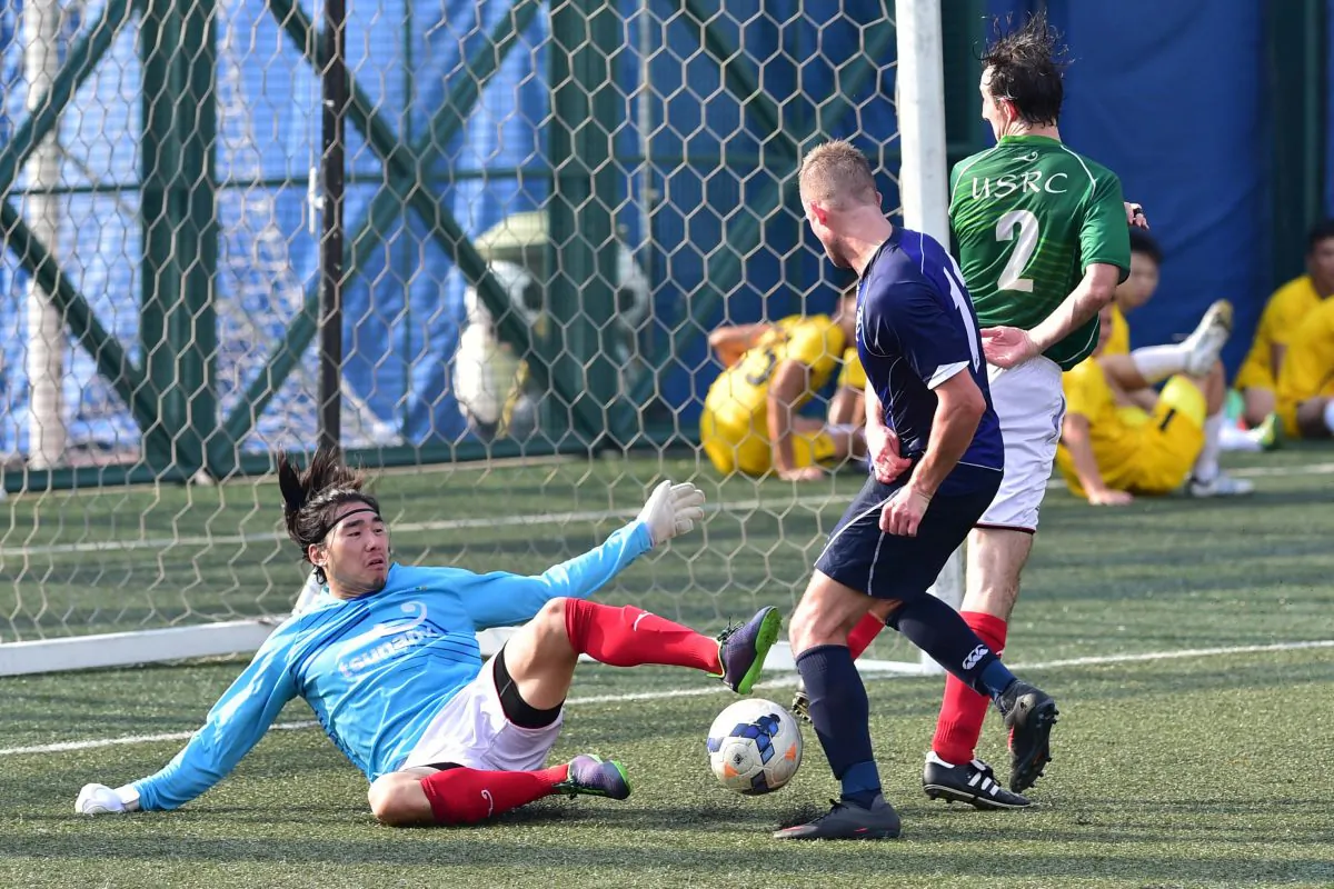 USRC goalkeeper Eugene Kan and Andy Mitchell defend against Wanderers during their nil-all draw at Sports Road on Sunday Sept 20, 2015. (Bill Cox/Epoch Times)