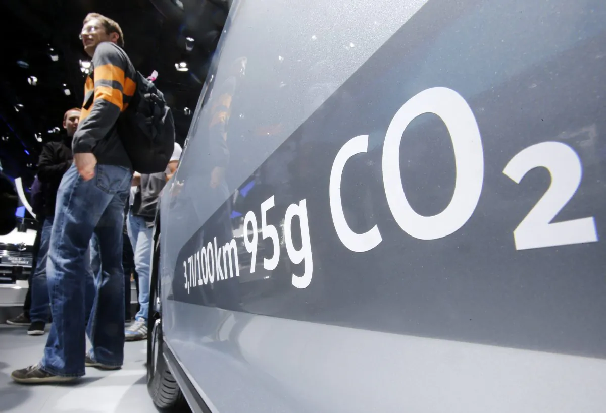 The amount of carbon dioxide emission is written on a Volkswagen Passat Diesel at the Frankfurt Car Show in Frankfurt, Germany, Tuesday, Sept. 22, 2015. (AP Photo/Michael Probst)