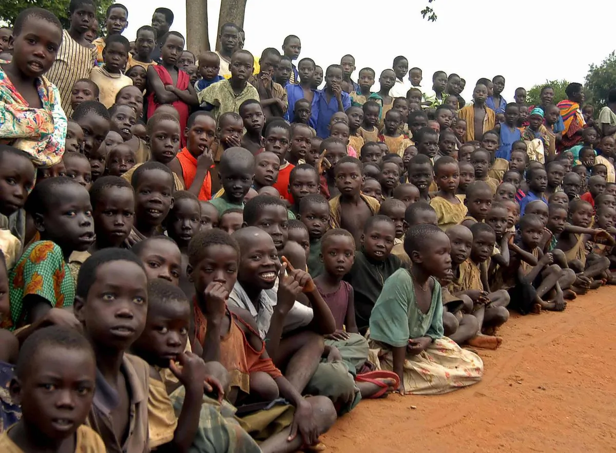 Ugandan children at a refugee camp in nothern Uganda during a visit by the U.N. Humanitarian Co-ordinator John Holmes, on May 15, 2007. (Peter Busomoke/AFP/Getty Images)